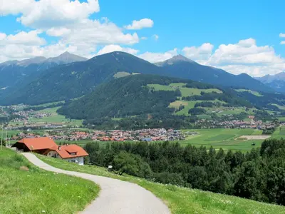 a winding road leading to a village in the mountains at Apartment Zollerhof - OLA190 by Interhome in Valdaora di Sotto