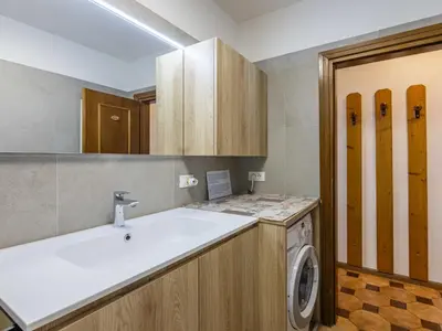 a bathroom with a sink and a washing machine at Apartment Cesa Micheluzzi - CZI712 by Interhome in Penia