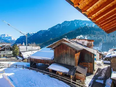 a view from the roof of a building in the snow at Apartment Valentini by Interhome in Mazzin