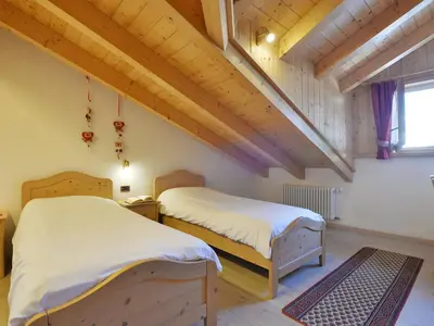 a kitchen with wooden cabinets and a sink at Apartment Maura-1 by Interhome in Pozza di Fassa