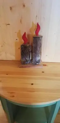 two vases sitting on top of a wooden table at Tabià Fregona, Chalet Alpino con vista e stile tradizionale in Fregona