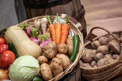 two baskets filled with vegetables on a table at Gschlunerhof in Castelrotto