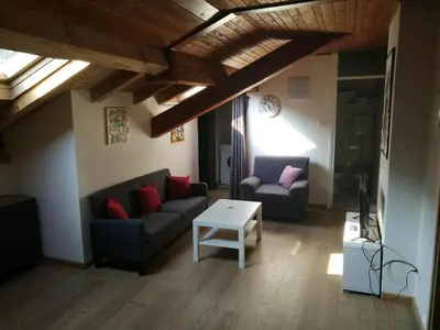 a living room with a couch and a table at Casa Renzo - Dolomiti - Trentino in Mezzano