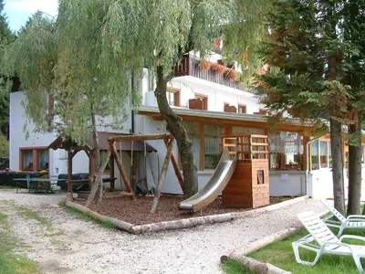 a playground in front of a house with a slide at Laugen B&B in San Felice