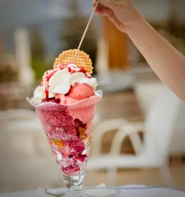 a ice cream sundae in a glass cup on a table at Laugen B&B in San Felice