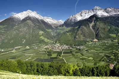 a village in a valley with mountains in the background at Fewo Dreiraum im Haus Götsch 6 in Parcines