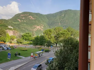 a view of a street with mountains in the background at Roma Ariston 8 in Bolzano