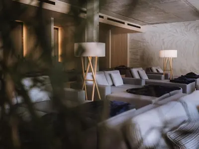 a room with a bunch of couches and lamps at Lindenhof Pure Luxury & Spa DolceVita Resort in Naturno