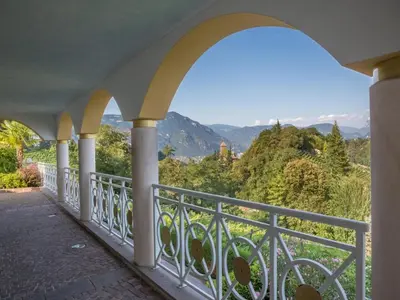 a balcony with a view of the mountains at Hotel Weinberg in Appiano sulla Strada del Vino