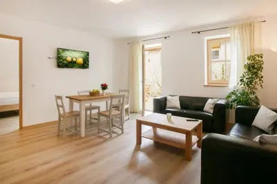 a living room with a couch and a table at Obstbauernhof Bundschuh - Dogs welcome in Appiano sulla Strada del Vino