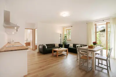 a living room with a couch and a table at Obstbauernhof Bundschuh - Dogs welcome in Appiano sulla Strada del Vino