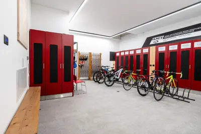 a row of bikes parked in a room with red lockers at -Antermoia- Appartament Canazei Center in Canazei