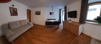 a living room with a couch and a table at Apartments Annemarie in Ortisei