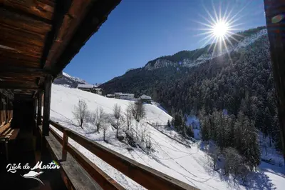 a view of a snow covered mountain from a cabin at Lüch de Martin in La Valle