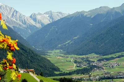a view of a valley in the mountains at Pizzeria Restaurant Wieser in Rasùn di Sotto