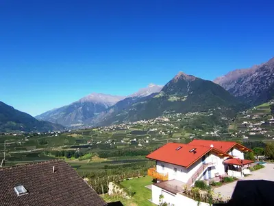 a view of a valley with mountains in the background at Der Blaue Reiter in Schenna