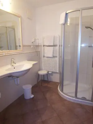 a bathroom with a sink and a shower at Appartement Tschivon in Schenna