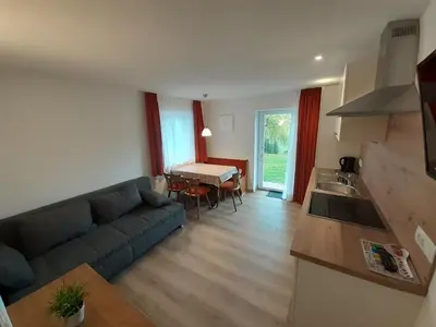a living room with a couch and a table at Prensanueva in Santa Cristina in Val Gardena