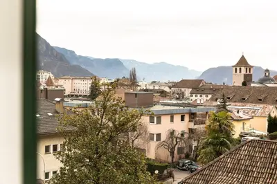 a view of a city with mountains in the background at Apartment Villa Schmid in Bolzano