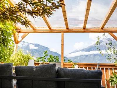 a balcony with a view of a mountain at Pension Chalet Andy in Schenna