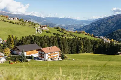 a house on a hill in a green field at Residence Speckerhof in Maranza