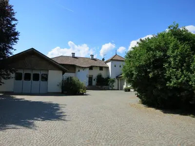 a large house with a driveway in front of it at Feldererhof in Postal
