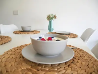 a bowl of cereal and fruit on a table at Appartement Baumgärtner in Naturno