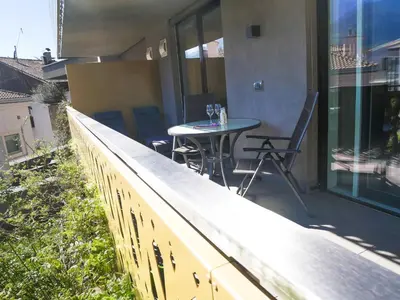 a patio with a table and chairs on a balcony at Appartement Baumgärtner in Naturno