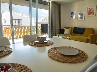 a living room with a table with plates on it at Appartement Baumgärtner in Naturno