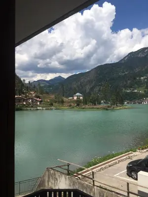 a view of a lake from a window at Monolocale DORI in Alleghe