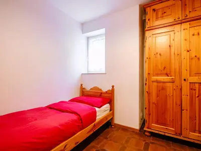 a bedroom with two bunk beds in a room at Apartment Mantina-1 by Interhome in Moena