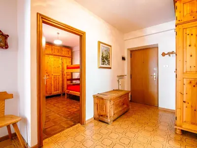 a bathroom with a sink and a toilet and a mirror at Apartment Mantina-1 by Interhome in Moena