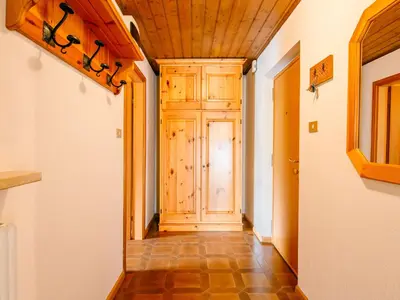 a bedroom with two beds and a wooden ceiling at Apartment Mantina-2 by Interhome in Moena