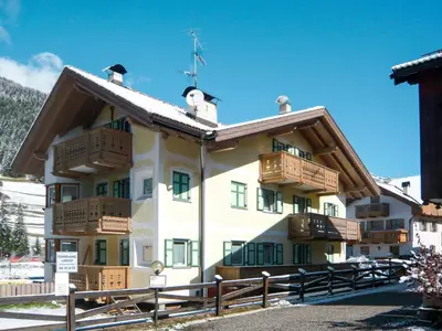 a building with balconies on the side of it at Apartment Maura-2 by Interhome in Pozza di Fassa