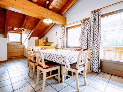 a snow covered village with mountains in the background at Apartment Carmen-1 by Interhome in Soraga