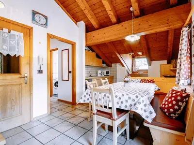 a kitchen with white walls and wooden ceilings at Apartment Carmen-1 by Interhome in Soraga
