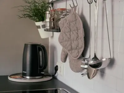 a kitchen counter with a coffee pot and a towel at Apartment Laura Brixen Vahrn in Varna