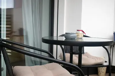 a table with a bowl and a candle on it at Apartment Laura Brixen Vahrn in Varna
