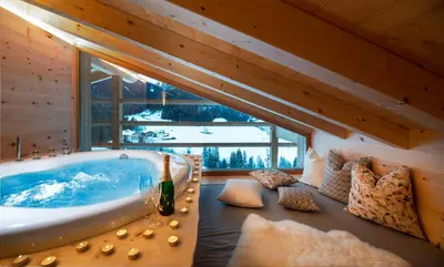 a room with a bath tub in a cabin at Unterkantiolerhof in Funes