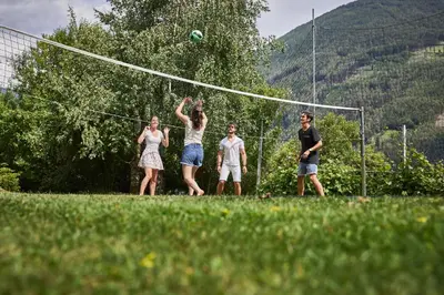 a group of people playing a game of volleyball at Ferienpension Zummüllerhof in Naz-Sciaves