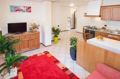 a living room with a kitchen and a living room at Casa al Moro in Rocca Pietore