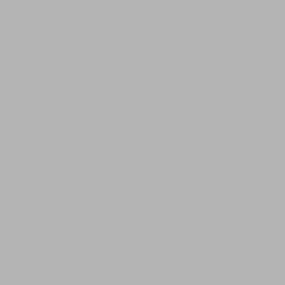 a room with two large beds and a living room at Furggerhof in Tirolo