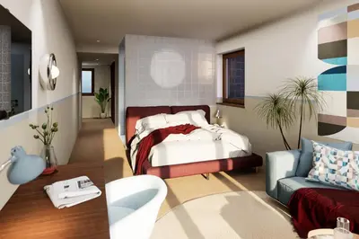 a bedroom with a bed and a couch at Pension zum Burggräfler in Schenna