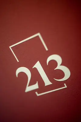 a close up of the number on a red background at Hotel Tenz in Montagna