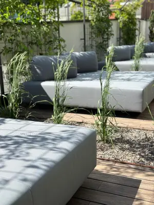 a row of beds sitting in a garden at Genusshotel Diamant in Naturno