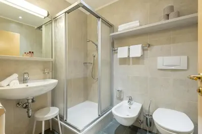 a bathroom with a shower and a sink and a toilet at Residence Sonnwies in Valdaora