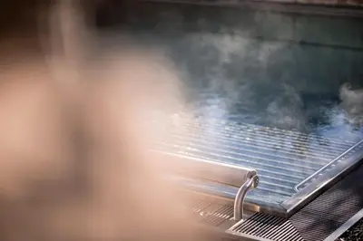 a grill with steam coming out of it at Hotel Alpenhof in Rasùn di Sotto