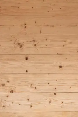 a close up of a wooden floor with wood grain at Casa Olimpia in Cortina dʼAmpezzo