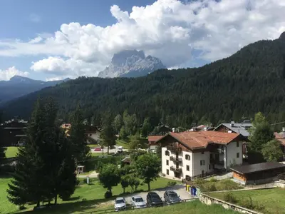 a view of a village with a mountain in the background at Casa Do Sol in San Vito di Cadore