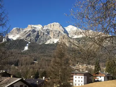 a view of a mountain range with snow covered mountains at Casa Majon in Cortina dʼAmpezzo